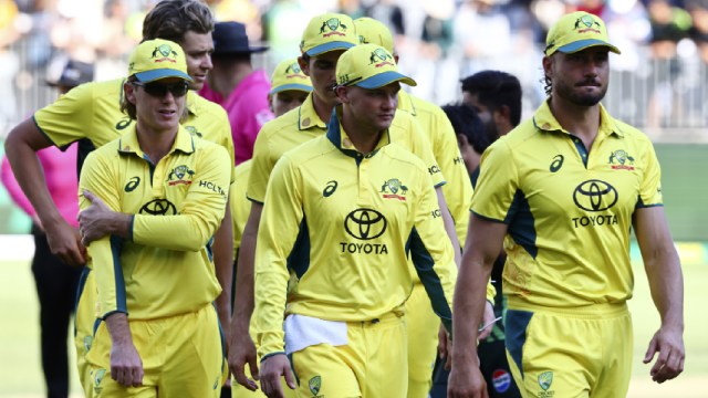 Australian players walk off the pitch after their loss to Pakistan during in their One Day International cricket match in Perth. (AP Photo)