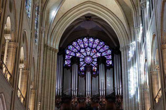 The western Rose window and the organ of Notre-Dame de Paris cathedral are seen while French President Emmanuel Macron visits the restored interiors of the monument, Friday Nov. 29, 2024, in Paris.