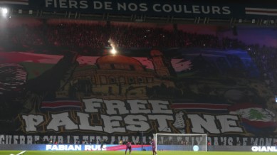 A giant banner reads "Free Palestine" is seen before the Champions League opening phase soccer match between Paris Saint Germain and Atletico Madrid at the Parc des Princes stadium in Paris, Wednesday, Nov. 6, 2024. (AP Photo)