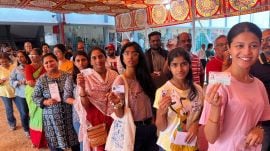 Voters queue up at a polling booth in Pune on Wednesday. (Express Photo: Pavan Khengre)