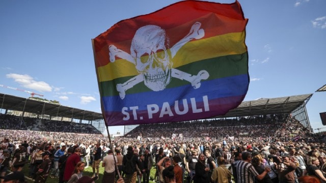 St Pauli's fans invade the field after their team won 3-1 during a second division, Bundesliga match at the Millerntor Stadium in Hamburg in May. (dpa via AP File)