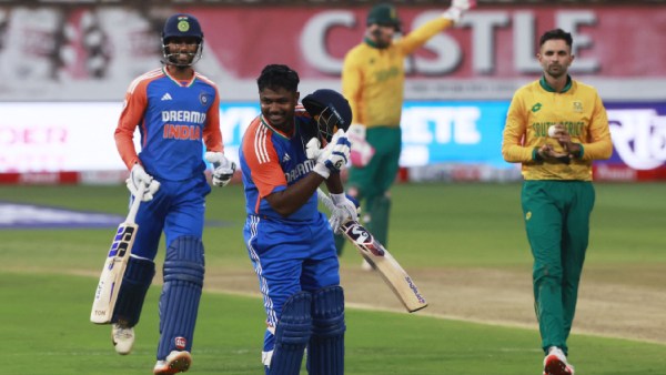 ndia's Sanju Samson celebrates after reaching his century