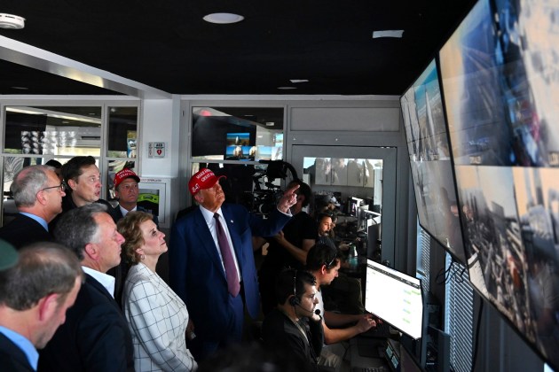 President-elect Donald Trump listens as Elon Musk explains the operations in the control room ahead of the launch of the sixth test flight of the SpaceX Starship rocket Tuesday, Nov. 19, 2024 in Boca Chica, Texas. (Brandon Bell/Pool via AP)