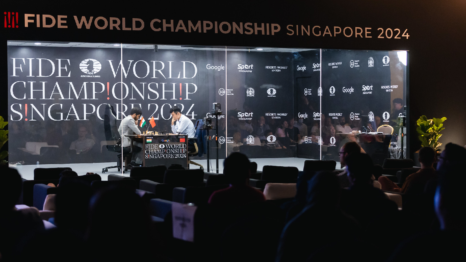 Ding Liren takes on Gukesh in the first game of the World Chess Championship. The players were playing in a sound-proof room with mirrored glass that prevented the players from looking outside or hearing noises from outside. (Photo: FIDE Flickr via Eng Chin An)