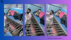 Passenger readies hammock-like setup inside packed train