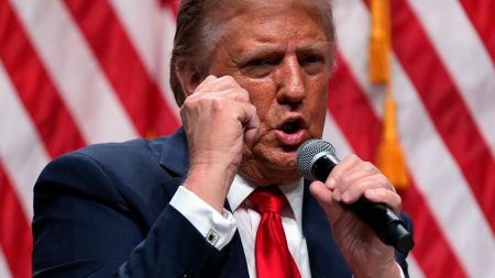 Republican presidential nominee former President Donald Trump speaks with Tucker Carlson during a Tucker Carlson Live Tour show at Desert Diamond Arena, Thursday, Oct. 31, 2024, in Glendale, Ariz. (AP Photo/Julia Demaree Nikhinson)