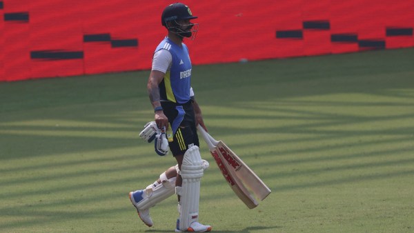 Virat Kohli walks out for a practice session ahead of the Indian cricket team's Test match against New Zealand at the Wankhede Stadium. (Express Photo by Amit Chakravarty)