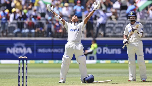 India's Yashasvi Jaiswal, left, celebrates his century as teammate India's KL Rahul applauds on the third day of the first cricket test between Australia and India in Perth, Australia. (AP)