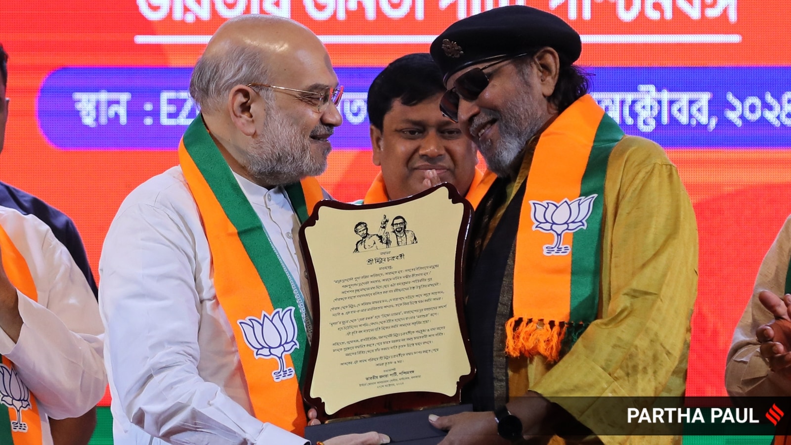 Union Home Minister Amit Shah with BJP leader Mithun Chakraborty. (Express photo by Partha Paul)
