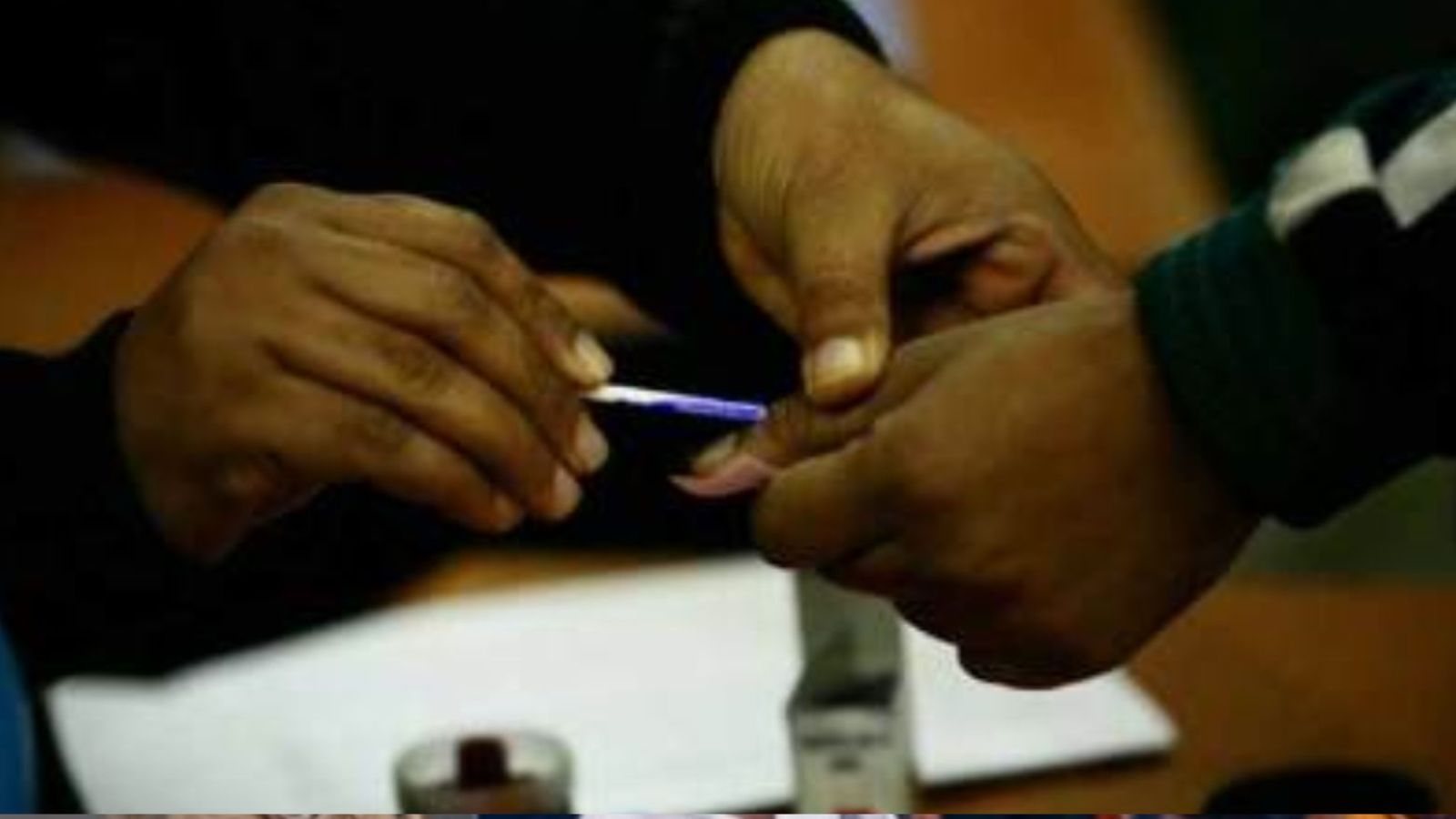 At ‘pardanashin’ booths, trained officers help with identity verification of burqa-clad voters