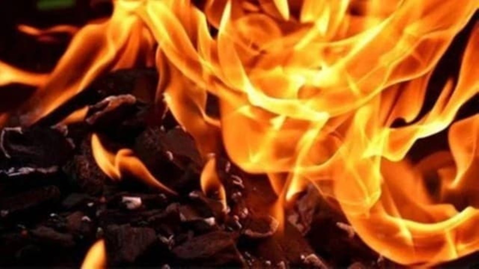 The police officer said the three men were sleeping inside when the fire erupted at the sofa-making factory.