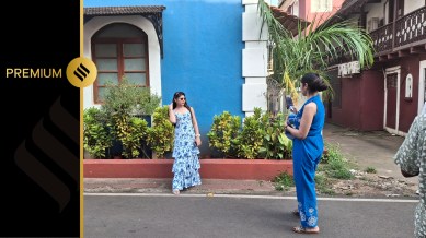 Tourists taking photos in a residential neighbourhood in Goa. (Express photo by Pavneet Singh Chadha)