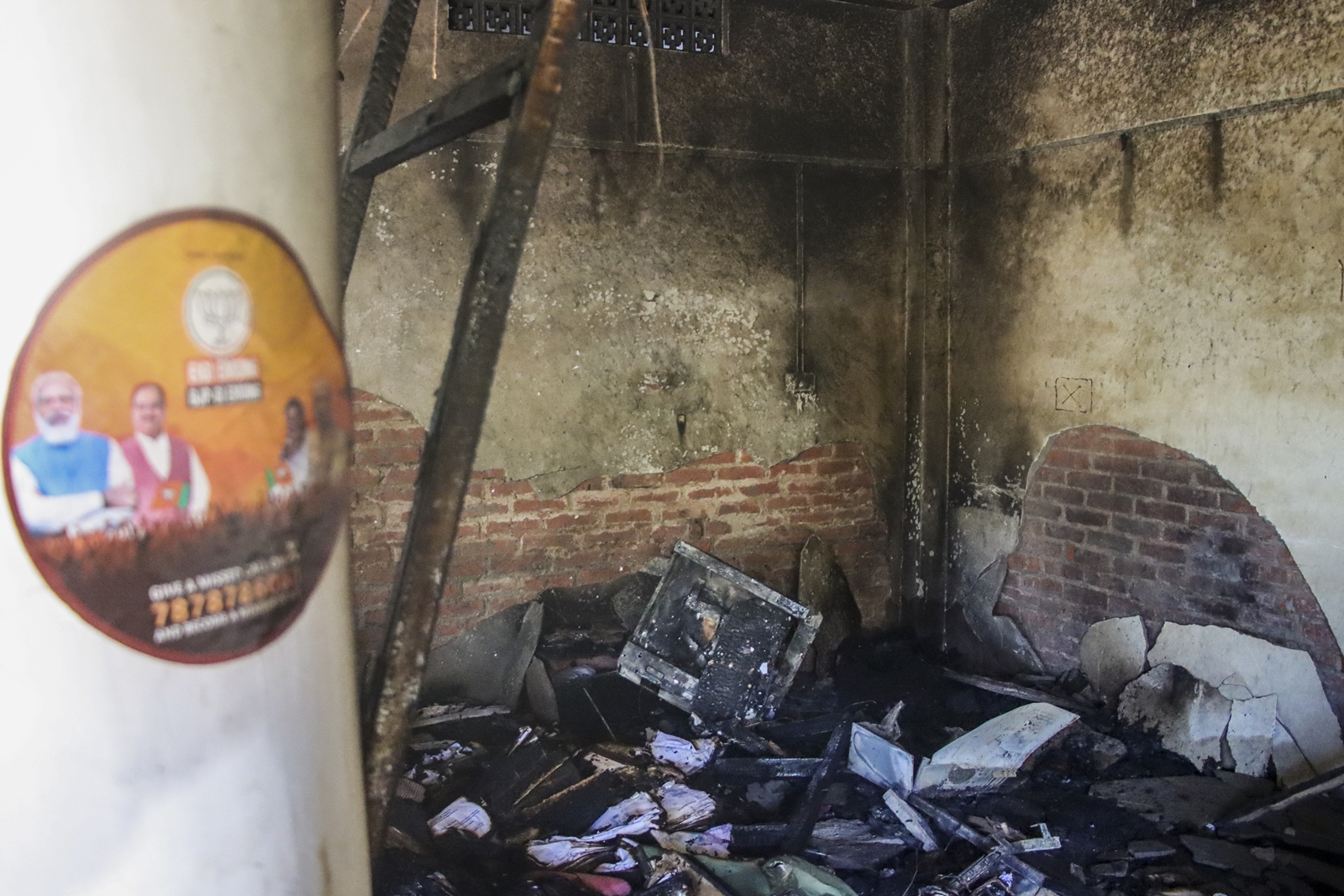 Charred remains of commodities at BJP leader and Manipur minister Govindas Konthoujam's residence, which was set on fire by some miscreants, at Ningthoukhong in Bishnupur district. (PTI)