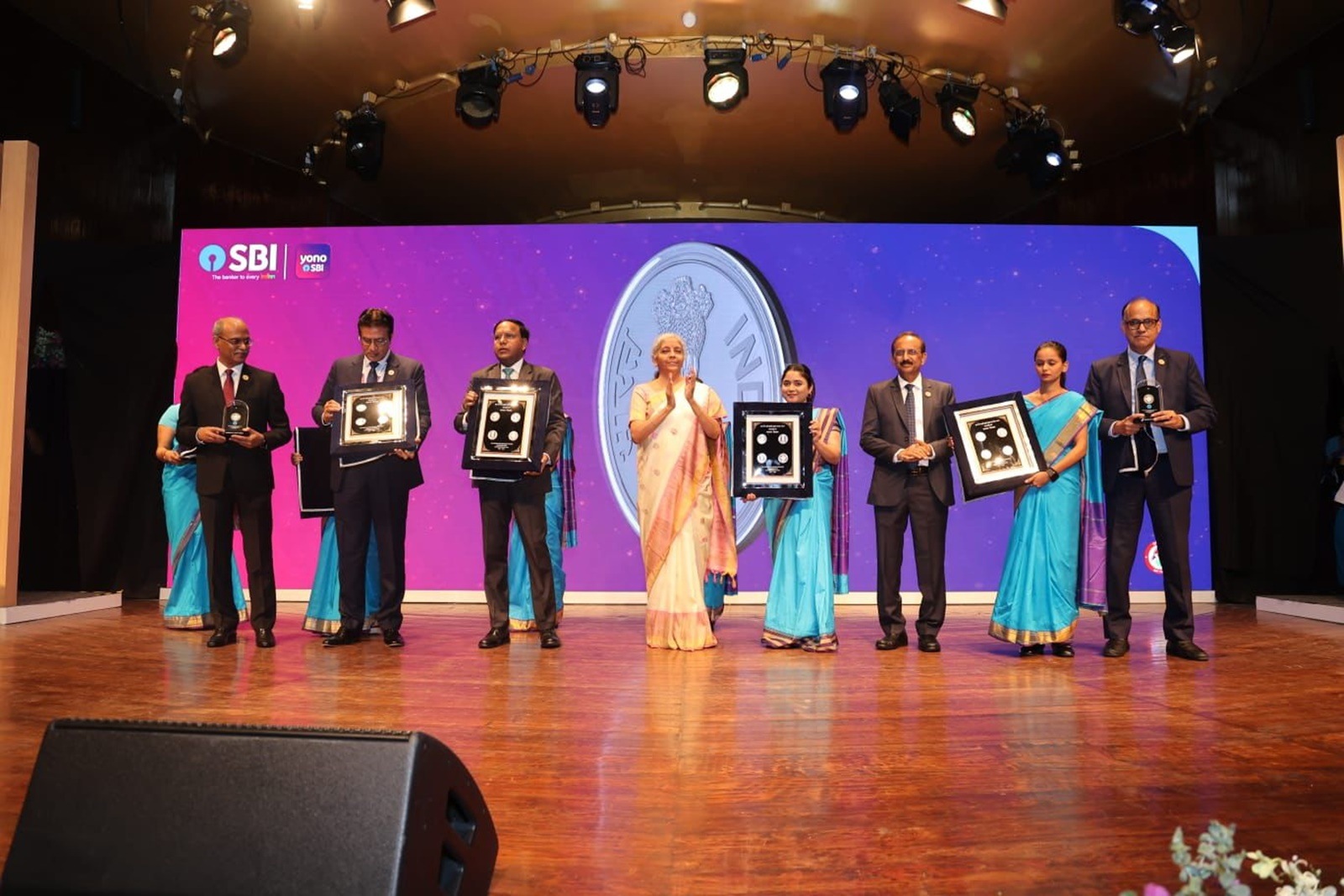 Union Finance Minister Nirmala Sitharaman with SBI Chairman CS Setty and other officers during centenary celebration of the main branch of State Bank of India (SBI Horniman branch) at NCPA, in Mumbai, Monday
