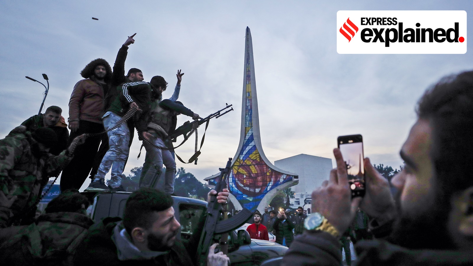 Syrians celebrate the arrival of opposition fighters in Damascus, Syria, Sunday, Dec. 8, 2024.