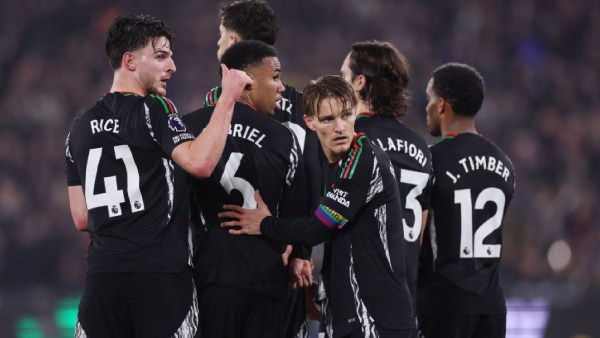 Arsenal's Gabriel Magalhaes, Martin Odegaard and Declan Rice ahead of a West Ham United free kick. (Reuters)