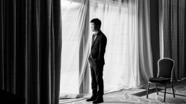 Ding Liren stares outside the window before the start of Game 7 of the World Chess Championship against Gukesh. (PHOTO: Maria Emelianova via FIDE)