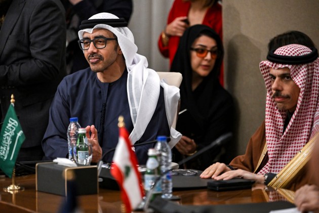 The UAE's Foreign Minister Sheikh Abdullah bin Zayed al-Nahyan and Saudi Arabia's Foreign Minister Prince Faisal bin Farhan al-Saud, right, during a meeting with the foreign ministers of the Arab Contact Group on Syria in Jordan's southern Red Sea coastal city of Aqaba, Saturday Dec. 14, 2024. (Andrew Caballero-Reynolds/Pool via AP)