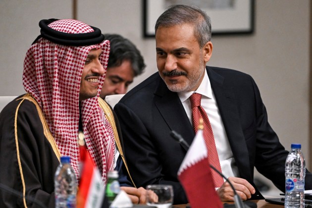 Qatar's Foreign Minister Sheikh Mohammed bin Abdulrahman bin Jassim al-Thani, left, speaks with Turkey's Foreign Minister Hakan Fidan during a meeting with the foreign ministers of the Arab Contact Group on Syria in Jordan's southern Red Sea coastal city of Aqaba, Saturday Dec. 14, 2024. (Andrew Caballero-Reynolds/Pool via AP)