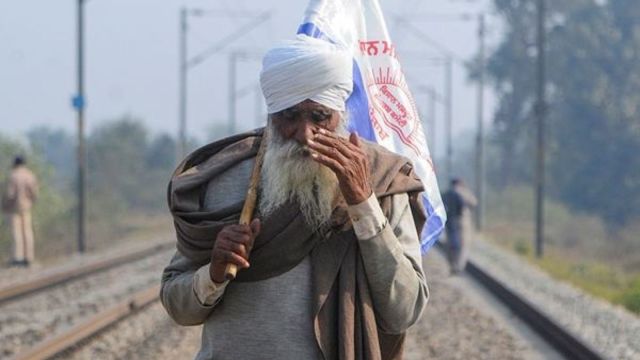 A farmer during the state-wide 'Rail Roko' protest to press the Centre for various demands including a legal guarantee for minimum support price, on the outskirts of Amritsar, Wednesday. (PTI Photo)