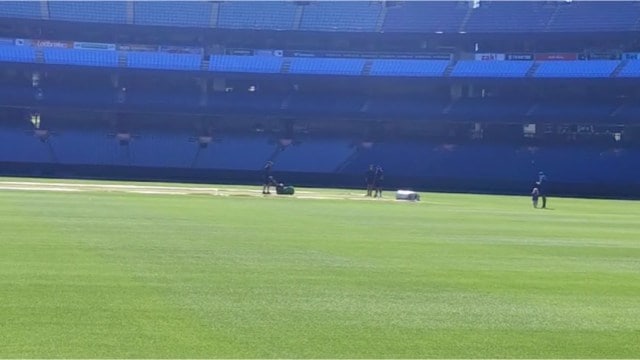 Ground staff work on the pitch at the Melbourne Cricket Ground ahead of the Boxing Day Test. (Express Photo)