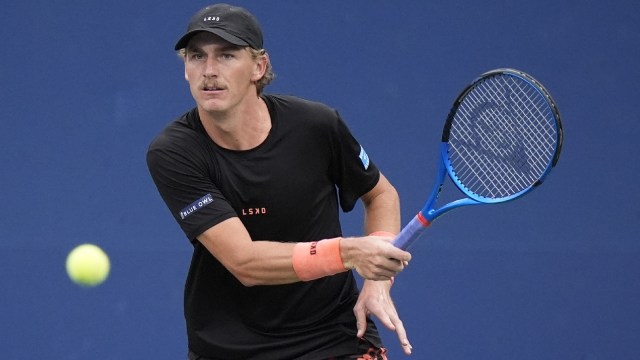 Max Purcell returns a shot to Tommy Paul, of the United States, during a second round match of the U.S. Open tennis championships. (AP)