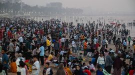 People enjoy the New Year’s Eve at Juhu beach in Mumbai on Tuesday. (Express photo by Sankhadeep Banerjee)