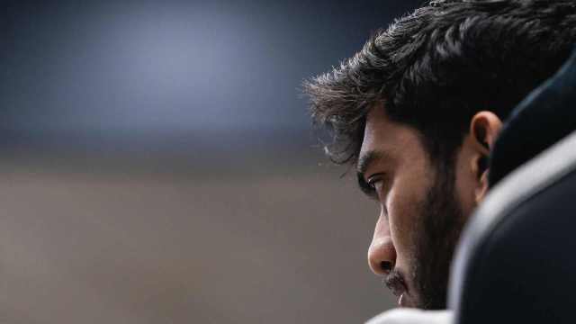 Gukesh contemplates his next move against Ding Liren in game 5 of the World Chess Championship in Singapore. (PHOTO: FIDE/Eng Chin An)