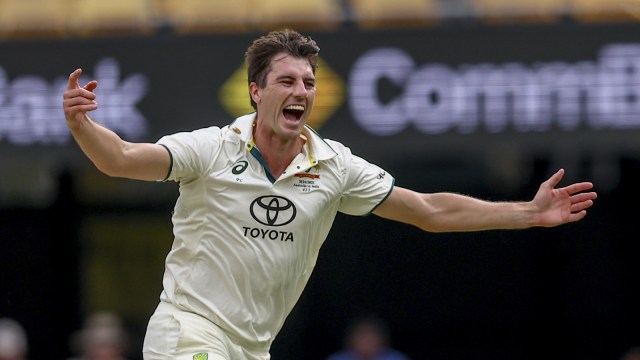 Australia's captain Pat Cummins celebrates the wicket of India's Nitish Kumar Reddy during play on day four of the third cricket test between India and Australia at the Gabba in Brisbane, Australia, Tuesday, Dec. 17, 2024. (AP Photo)