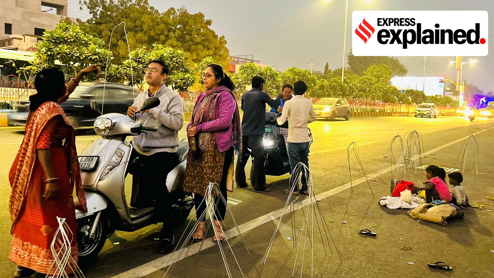 Kite string guards being affixed on a two-wheeler in Ahmedabad. (Express photo by Bhu