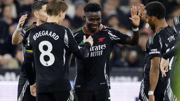 4 Arsenal's Bukayo Saka celebrates scoring their fifth goal with Arsenal's Jurrien Timber and Arsenal's Martin Odegaard 