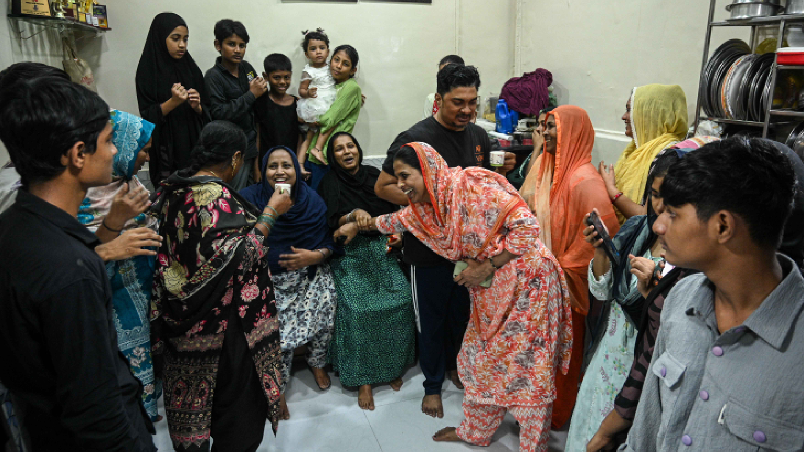 The family of Simran Shaikh pose at Simran’s residence at Dharavi slum area after she became the most expensive buy of Women's Premier League (WPL) 2025 with Gujarat Giants paying Rs 1.90 crore. (Express photo by Sankhadeep Banerjee)