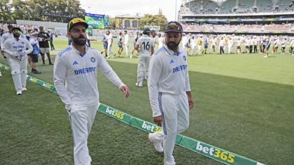 India's captain Rohit Sharma, right, and teammate Virat Kohli leave the field after their loss in the second cricket test match against Australia at the Adelaide Oval in Adelaide, Australia. (AP)