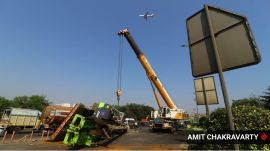 A large crane over turned on Saturday morning on Eastern Express Highway near Vikhroli causing huge traffic jams in and around the area .