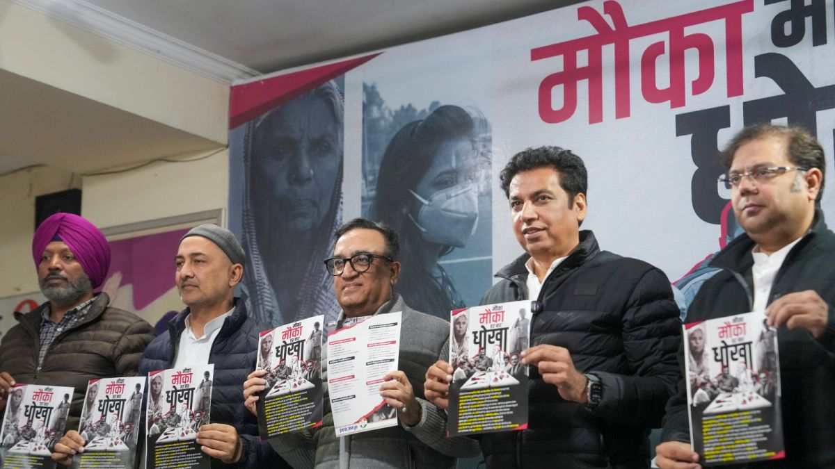 AICC treasurer Ajay Maken and Delhi Congress President Devender Yadav release a booklet against BJP and AAP titled 'Mauka Mauka Har Baar Dhokha', in New Delhi, Wednesday,