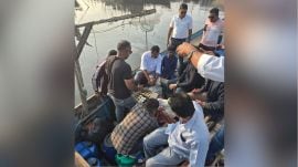 Somnath Marine Police and LCB staff raided the part of the coast where they found two men and the boat filled with liquor. (Express Photo)