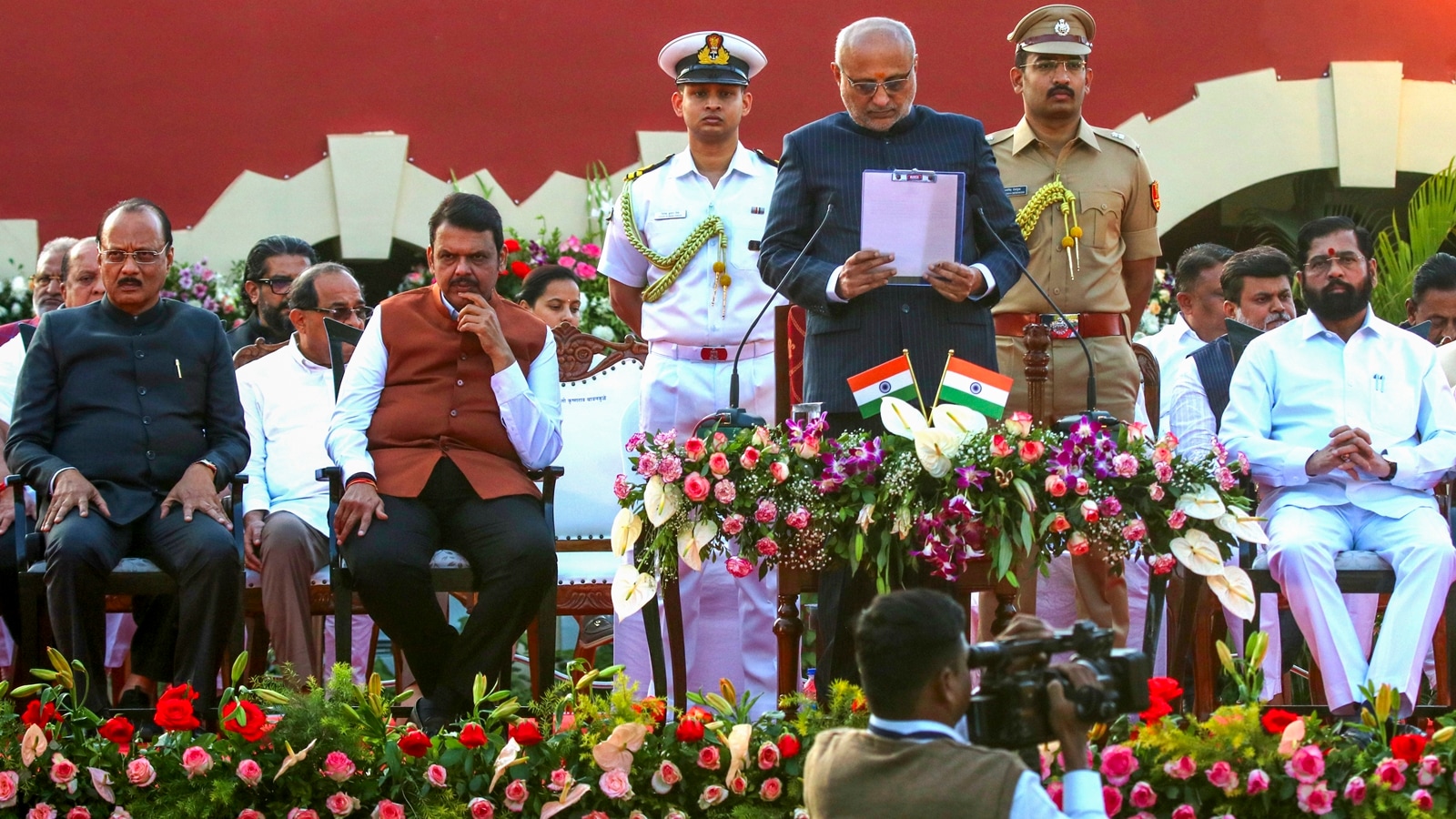 Maharashtra Governor CP Radhakrishnan, Chief Minister Devendra Fadnavis, Deputy CMs Ajit Pawar and Eknath Shinde at the swearing-in ceremony of cabinet ministers in Nagpur. (PTI)