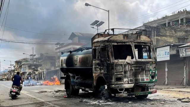 A damaged water tanker that was set afire during a protest by tribal groups in Churachandpur in Manipur. (Reuters File Photo)