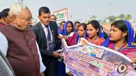 Bihar Chief Minister Nitish Kumar meets 'Jeevika Didi' during 'Pragati Yatra', in Motihari, Tuesday. (PTI Photo)