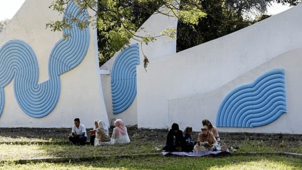 People visit the Siron mass grave, where victims of the 2004 Indian Ocean tsunami are buried, during the 20-years anniversary of the Indian Ocean tsunami, in Aceh Besar, Indonesia. 