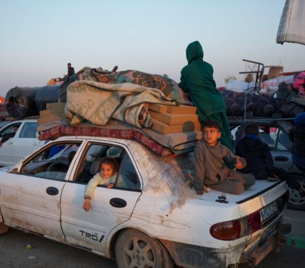 Displaced Palestinians make their way from central Gaza to their homes in the northern Gaza Strip, after Israel began allowing hundreds of thousands of Palestinians to return as part of the ceasefire deal between Israel and Hamas. (AP Photo/Abdel Kareem Hana)