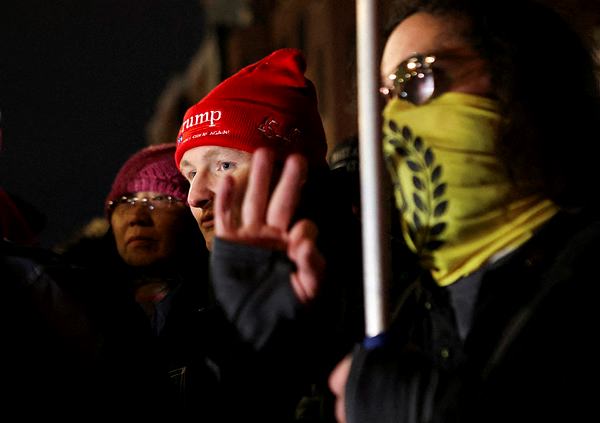 Gregory Purdy, flanked by a member of the Proud Boys, after being released from prison. (Reuters)