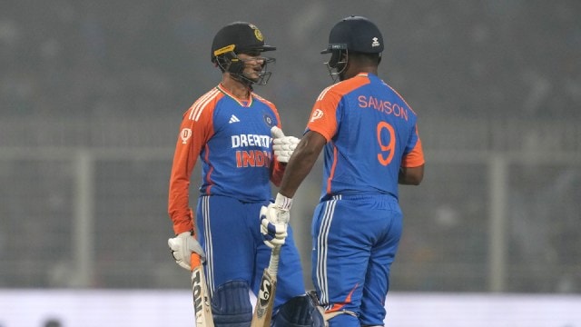 Abhishek Sharma, left, and Sanju Samson talk during the first T20I cricket match between India and England at Eden Gardens in Kolkata, India, Wednesday, Jan. 22, 2025. (AP Photo)