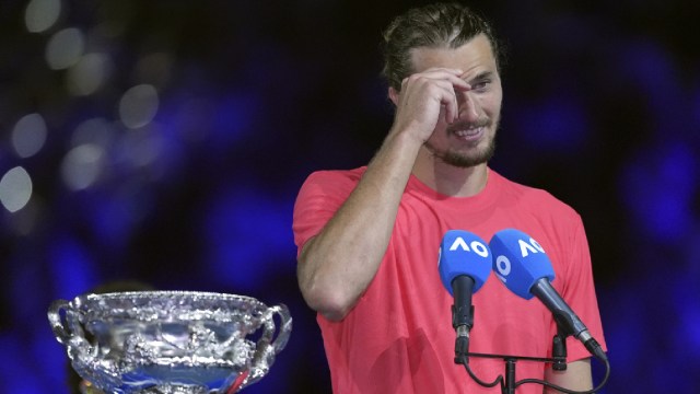 Alexander Zverev of Germany reacts during his speech following the men's singles final against Jannik Sinner of Italy at the Australian Open tennis championship in Melbourne, Australia, Sunday, Jan. 26, 2025. (AP Photo)