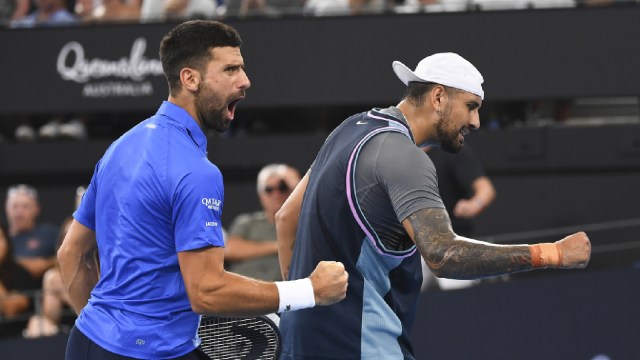 Novak Djokovic and Nick Kyrgios react during their doubles match against Serbia's Nikola Mektic and Michael Venus at the Brisbane International on Wednesday. (PHOTO: AAP Image via AP)