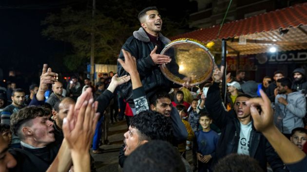 Palestinians celebrate the announcement of a ceasefire deal between Hamas and Israel in Deir al-Balah, central Gaza Strip. (Photo: AP)