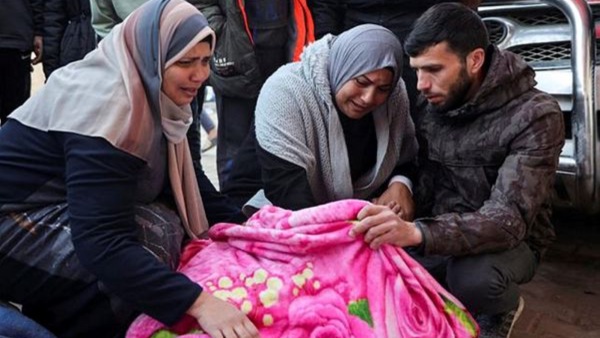 Palestinians mourn at funerals of those lost in the overnight sir strikes carried out by Israel at Al-Aqsa Martyrs Hospital in Deir Al-Balah in the central Gaza Strip. 