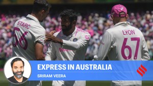 India's Jasprit Bumrah, centre, shakes hands with Australia's Mitchell Starc as Nathan Lyon watches at the end of the fifth cricket test between India and Australia at the Sydney Cricket Ground, in Sydney, Australia, Sunday, Jan. 5, 2025. (AP Photo)