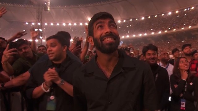 India cricketer Jasprit Bumrah reacts as Coldplay's Chris Martin performs a personalised song for him at Ahmedabad's Narendra Modi Stadium. (Screenshot: Hotstar)