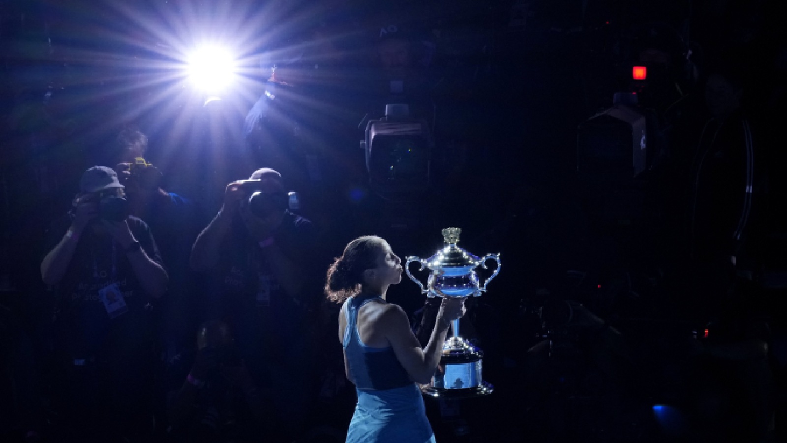 Madison Keys of the U.S. kisses the Daphne Akhurst Memorial Cup after defeating Aryna Sabalenka of Belarus in the women's singles final at the Australian Open tennis championship in Melbourne, Australia, Saturday, Jan. 25, 2025. (AP Photo)